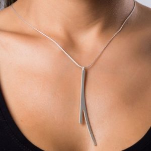 Ramification I neck pendant finished in matt silver on model.